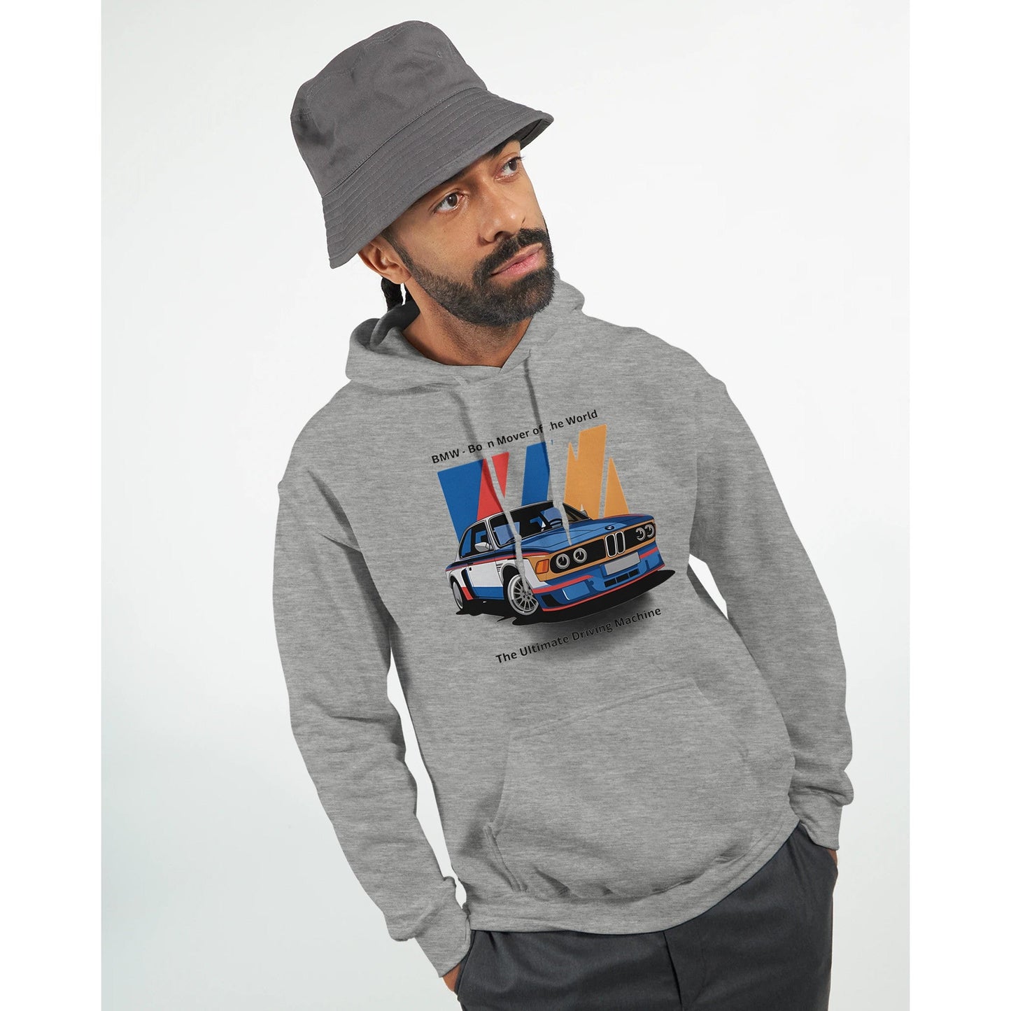 man wearing grey born to race unisex hoodie with car graphic and bucket hat