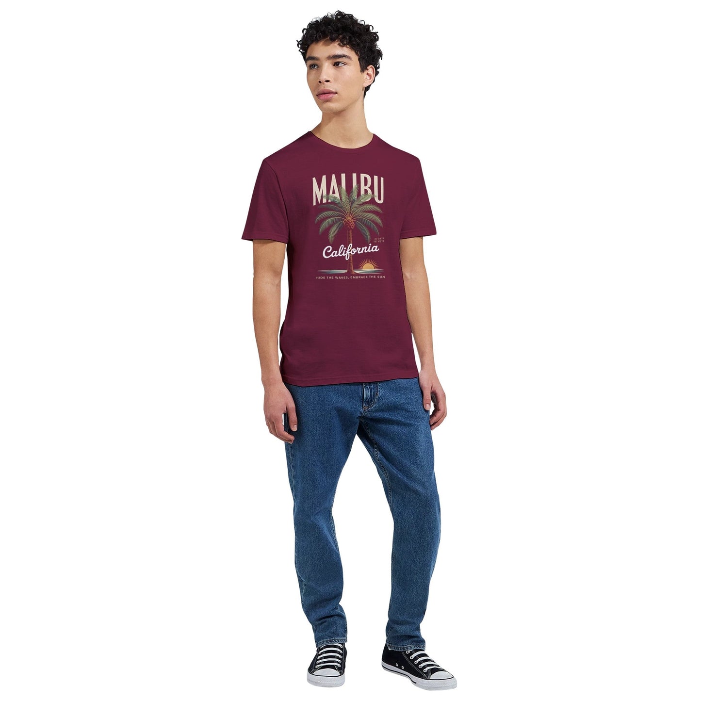 california sunshine sommer t-shirt in burgundy with malibu palm tree print, worn by a male model in casual jeans and sneakers