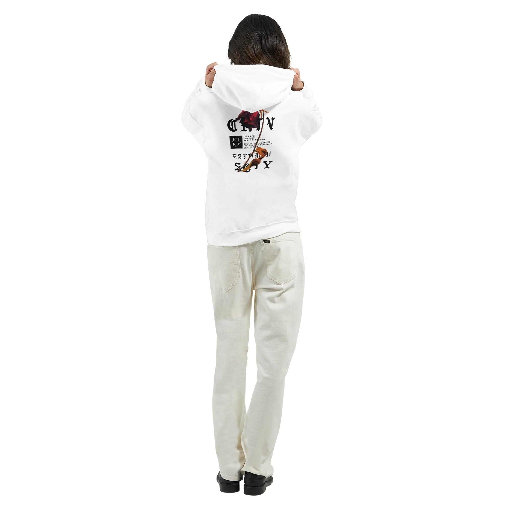 Person wearing white Lira Streetwear Hoodie with graphic design on back, paired with light-colored pants and black shoes, standing facing away