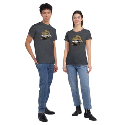Premium unisex summer car t-shirt in charcoal gray with vintage car graphic, modeled by male and female wearing casual jeans and black shoes.