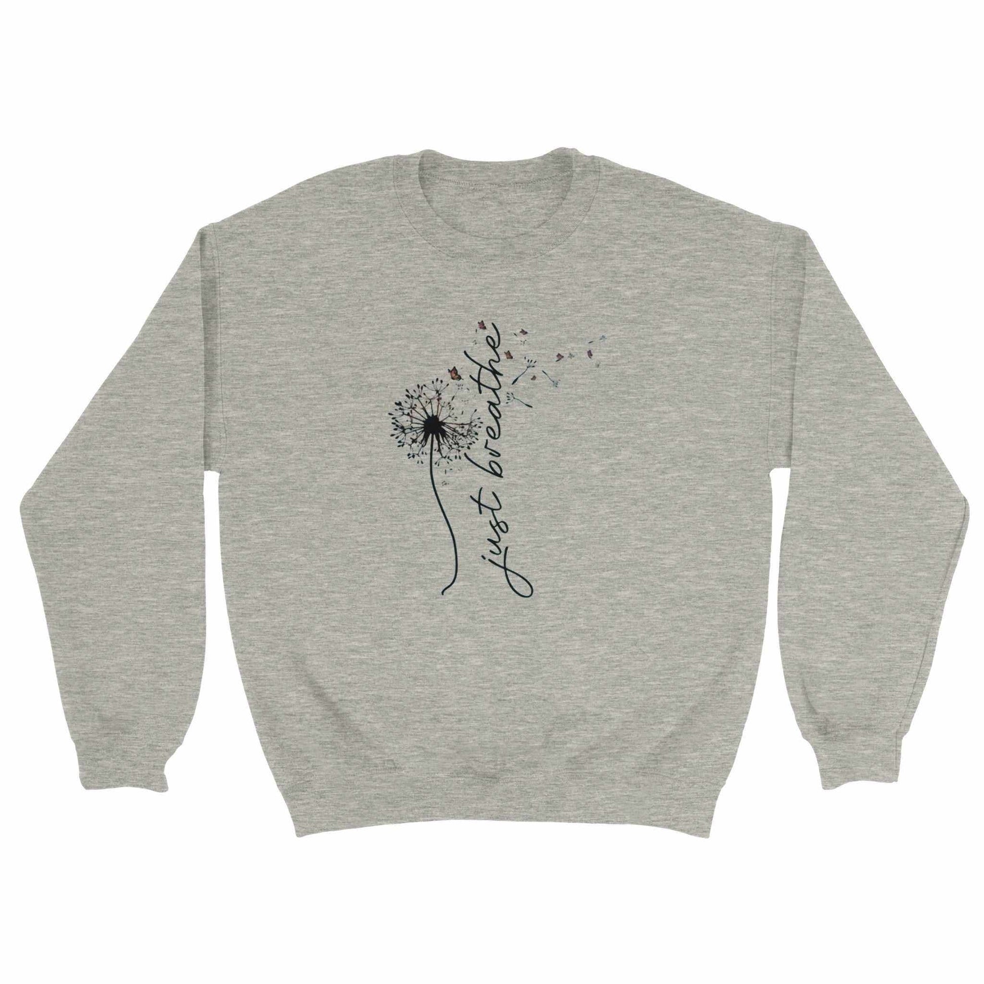Kuscheliger Entspannungspullover in Grau mit Dandelion-Design und Schriftzug "just breathe"